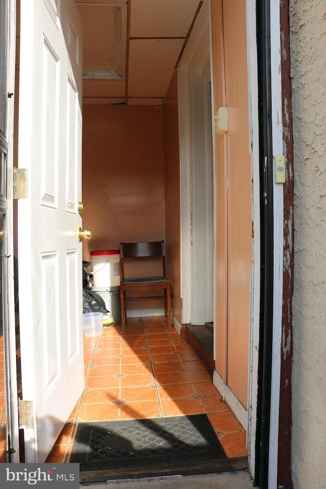 corridor featuring light tile patterned floors