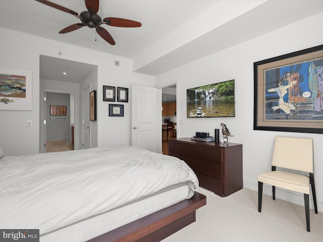 bedroom featuring a ceiling fan and light colored carpet