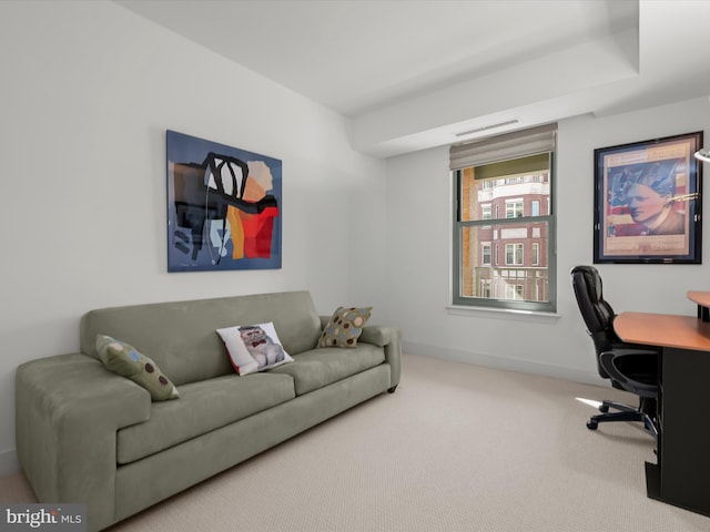 carpeted office featuring visible vents and baseboards