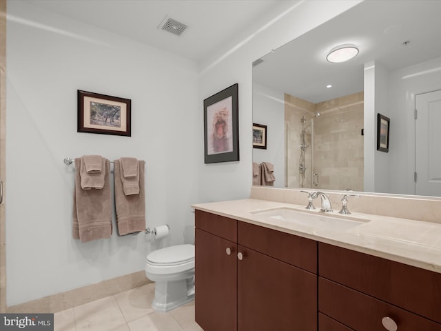 bathroom featuring visible vents, toilet, vanity, a shower stall, and tile patterned floors