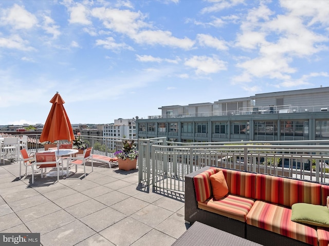 view of patio / terrace with outdoor dining space and a balcony