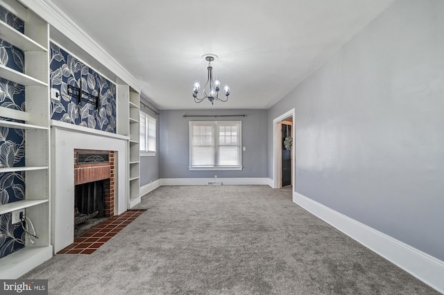 unfurnished living room with a fireplace, a chandelier, and dark carpet