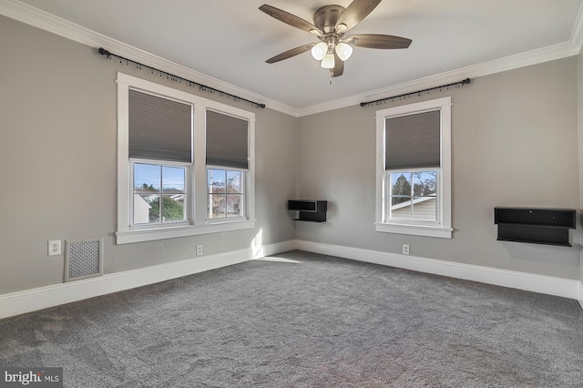 empty room featuring dark carpet, ceiling fan, and crown molding