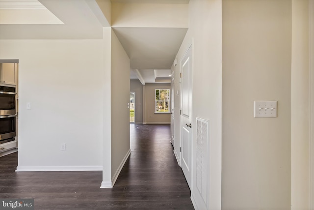 corridor featuring dark hardwood / wood-style floors