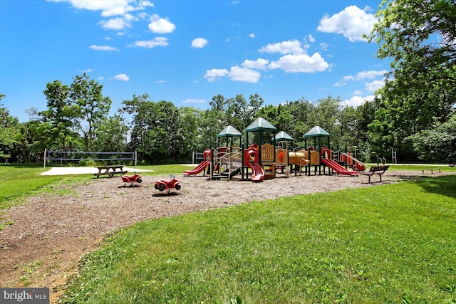 view of playground with a lawn