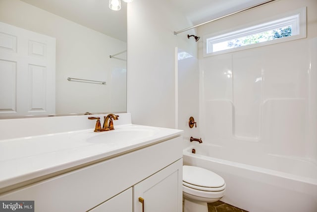 full bathroom featuring shower / tub combination, vanity, and toilet