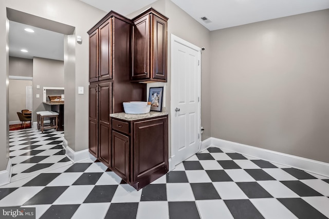 interior space with dark brown cabinets