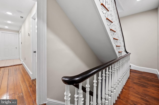 stairs with wood-type flooring