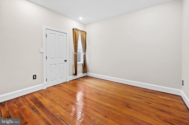 spare room featuring hardwood / wood-style flooring