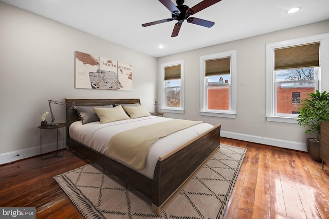 bedroom featuring ceiling fan and dark hardwood / wood-style floors