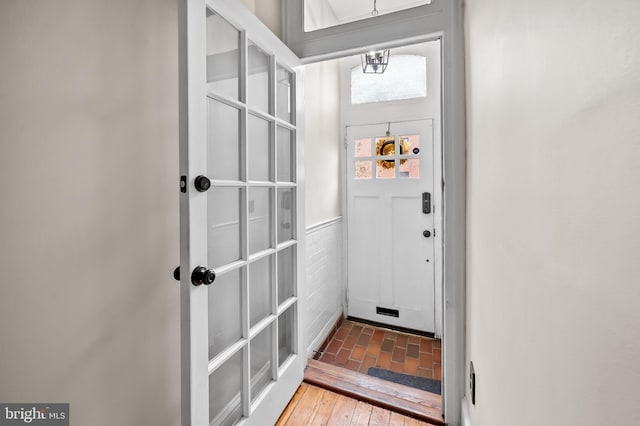 doorway to outside featuring hardwood / wood-style flooring