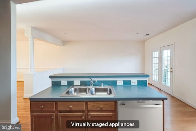 kitchen featuring french doors, light hardwood / wood-style flooring, stainless steel dishwasher, and sink