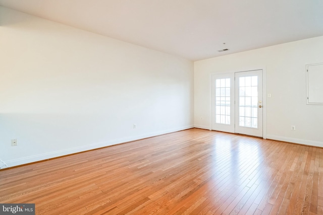 unfurnished room featuring light wood-type flooring