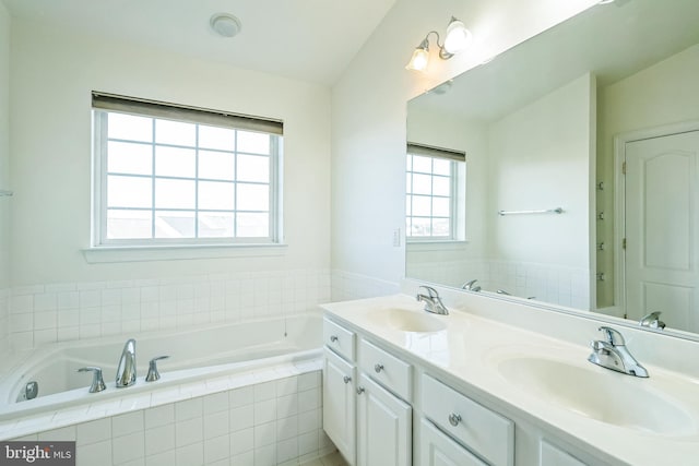 bathroom featuring vanity and vaulted ceiling