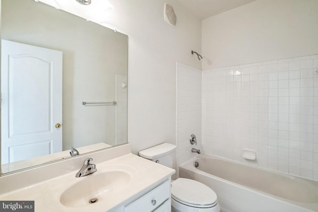 full bathroom with vanity, toilet, and tiled shower / bath