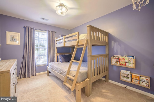 bedroom featuring light colored carpet