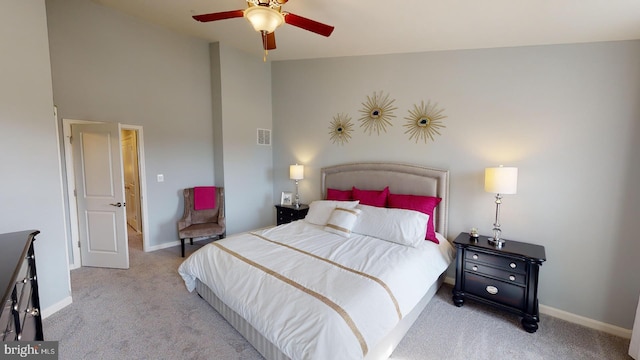 carpeted bedroom featuring ceiling fan and lofted ceiling