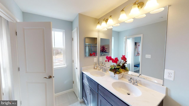 bathroom featuring tile patterned flooring and vanity