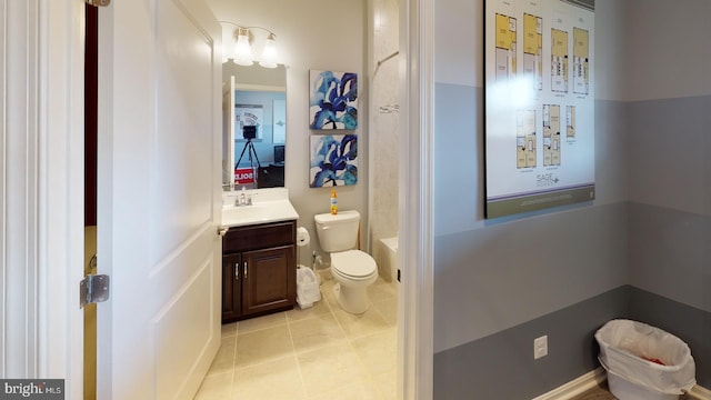 bathroom featuring toilet, vanity, and tile patterned floors