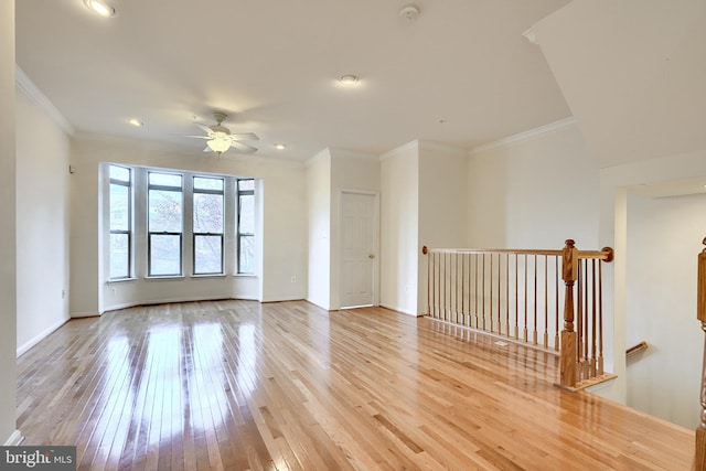 spare room featuring ceiling fan, light hardwood / wood-style flooring, and ornamental molding