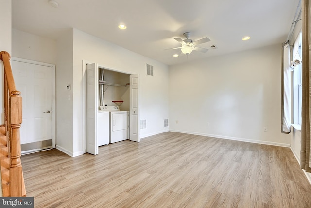 unfurnished bedroom with independent washer and dryer, a closet, light hardwood / wood-style flooring, and ceiling fan