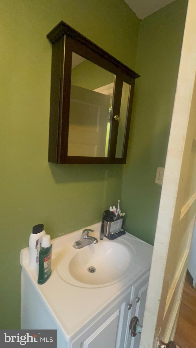 bathroom featuring hardwood / wood-style floors and vanity