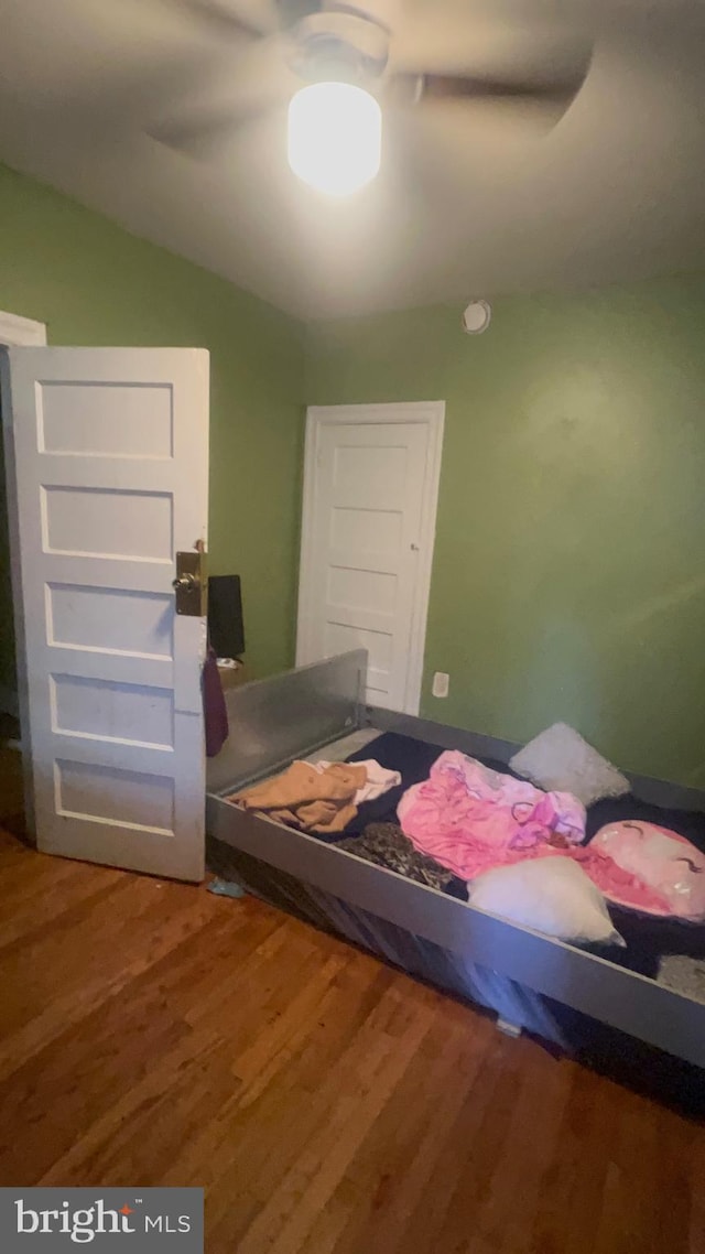 bedroom with hardwood / wood-style flooring and ceiling fan