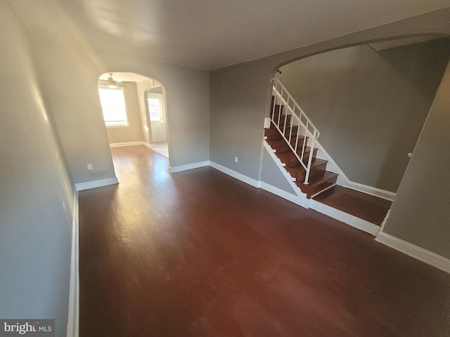 empty room with dark hardwood / wood-style floors