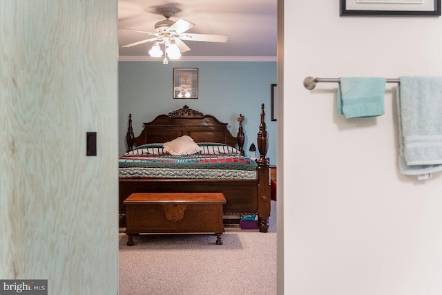 bedroom with carpet flooring, ceiling fan, and crown molding