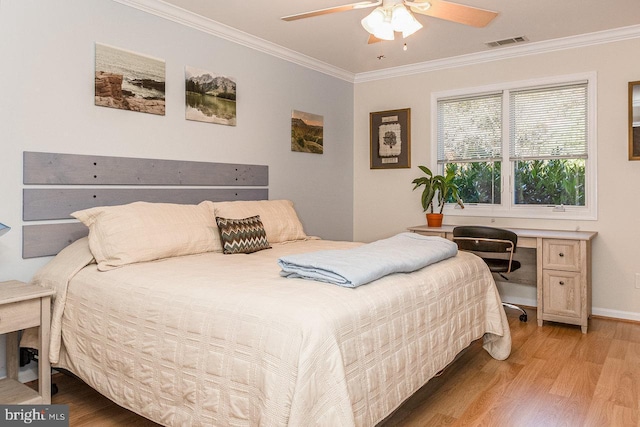 bedroom with hardwood / wood-style floors, ceiling fan, and ornamental molding