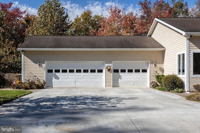 view of side of home with a garage