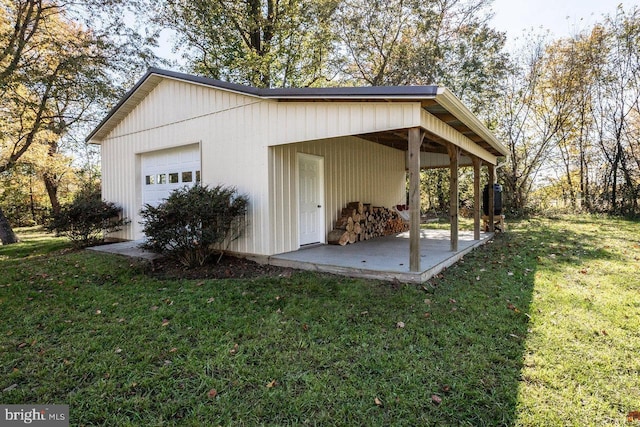 exterior space featuring a lawn and a garage