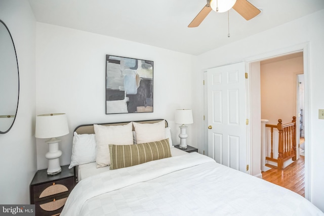 bedroom with ceiling fan and hardwood / wood-style floors