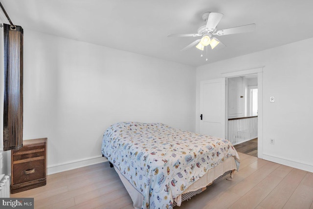 bedroom featuring light hardwood / wood-style flooring and ceiling fan