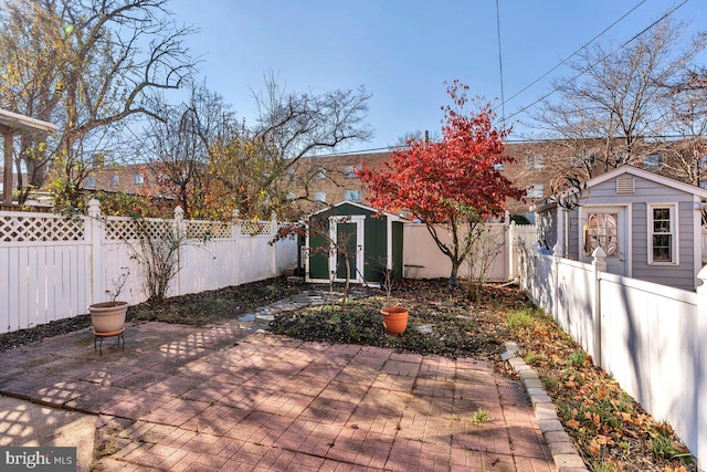 view of patio with a storage unit