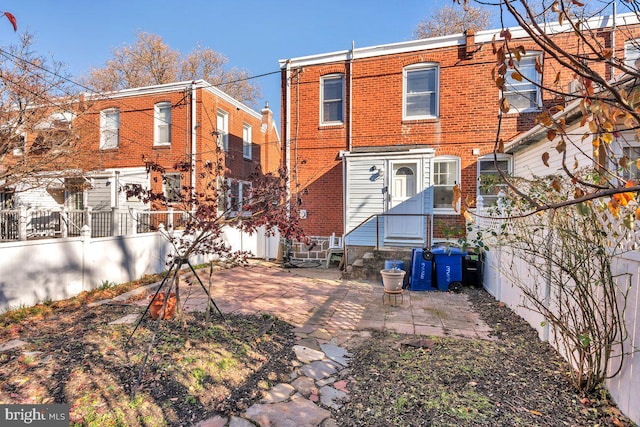 back of property featuring a patio area