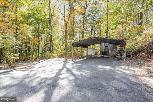 view of vehicle parking featuring a carport