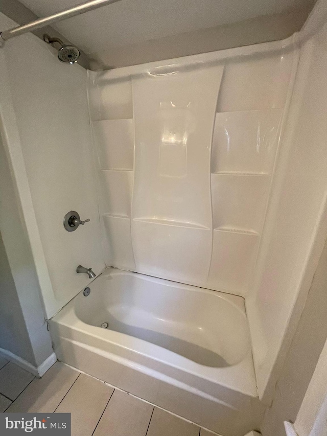 bathroom featuring tile patterned floors and bathtub / shower combination