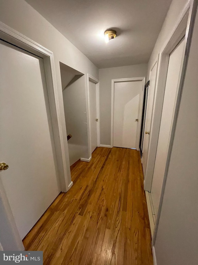 corridor featuring light hardwood / wood-style floors