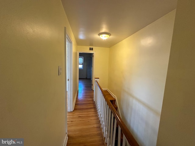 corridor with light wood-type flooring