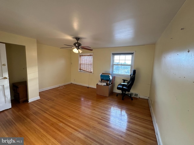 unfurnished room featuring ceiling fan and wood-type flooring