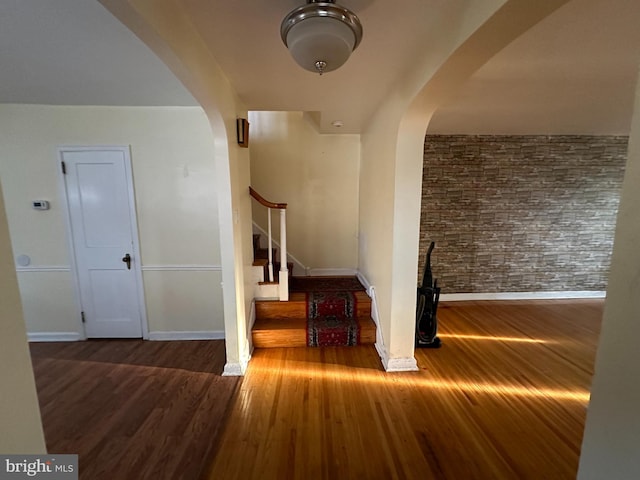 stairway featuring wood-type flooring