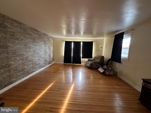 unfurnished living room with hardwood / wood-style flooring