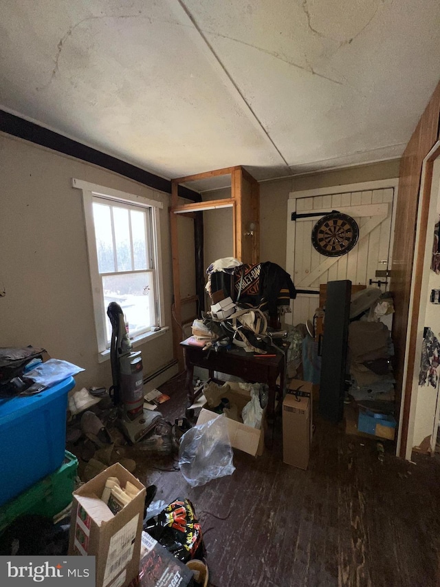 miscellaneous room with wood-type flooring and a textured ceiling