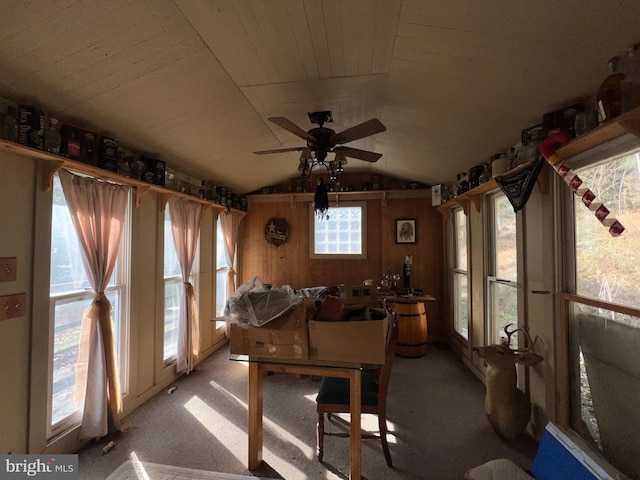 sunroom featuring ceiling fan and lofted ceiling