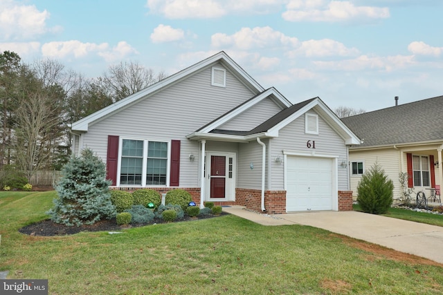 view of front of house with a garage and a front lawn