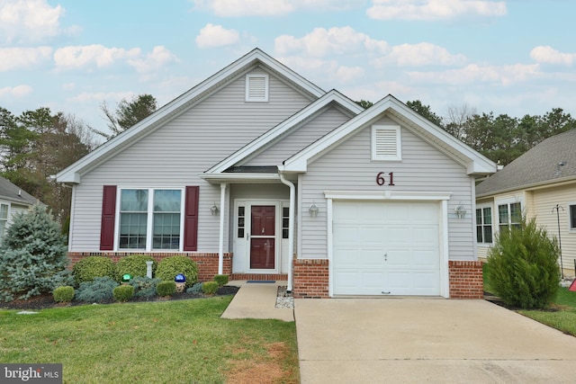 view of front of home with a garage and a front lawn