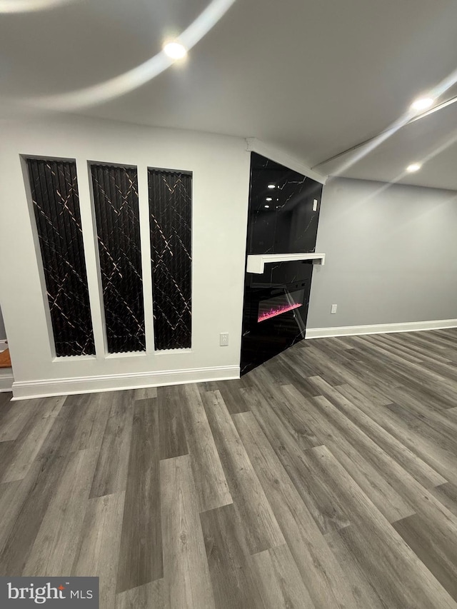 5111 Warrington Ave, Philadelphia, PA 19143 - unfurnished room with a fireplace and wood finished floors