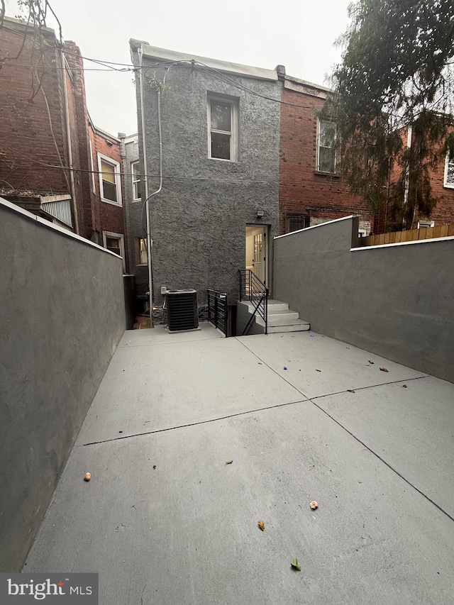5111 Warrington Ave, Philadelphia, PA 19143 - rear view of house with a patio area and stucco siding