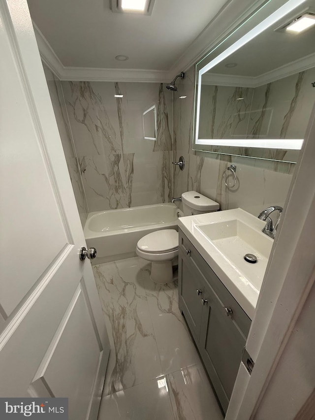 full bathroom with toilet, vanity, ornamental molding, and tiled shower / bath